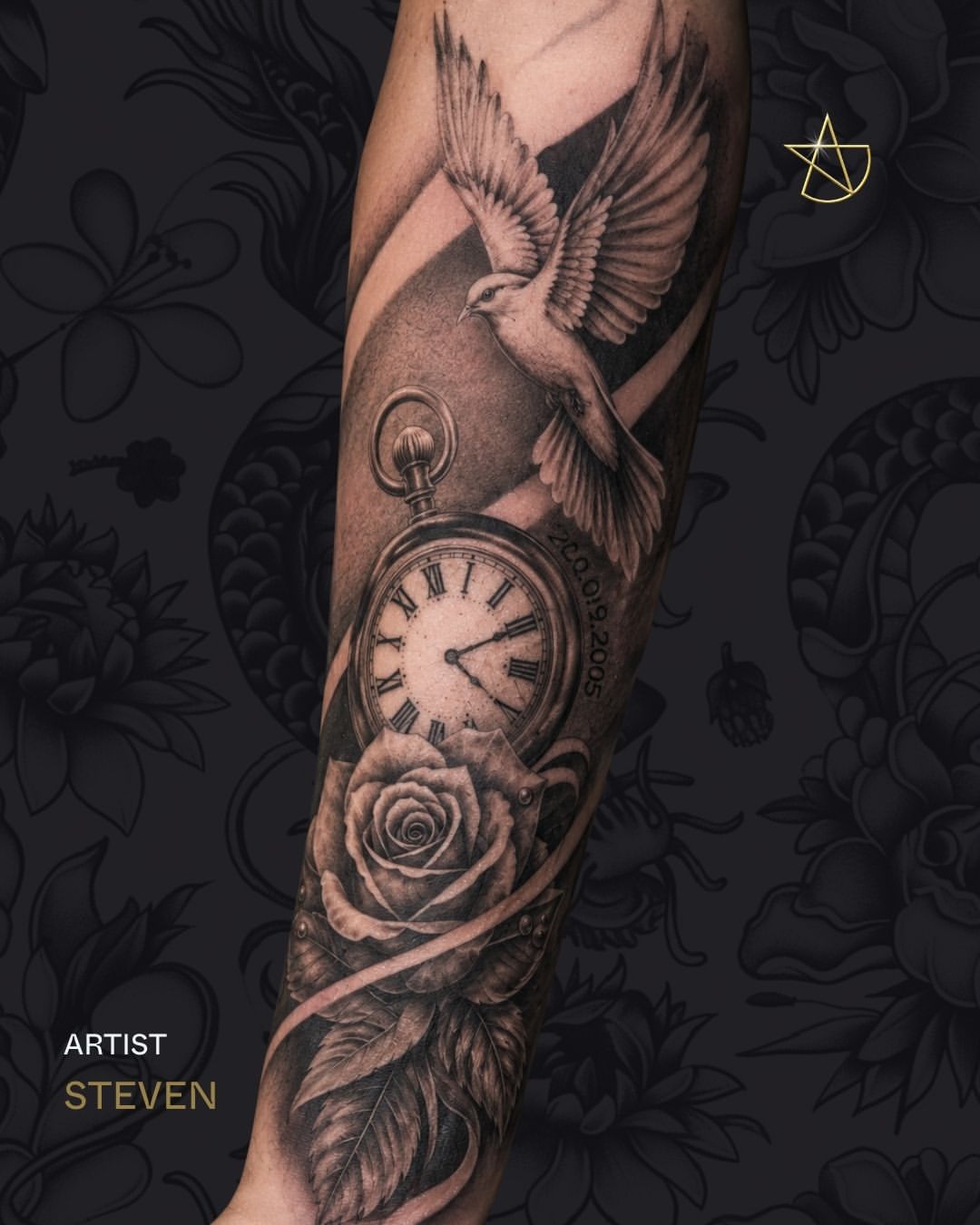 Black and grey sleeve tattoo featuring a dove, pocket watch with Roman numerals, and rose with feather details on the forearm.