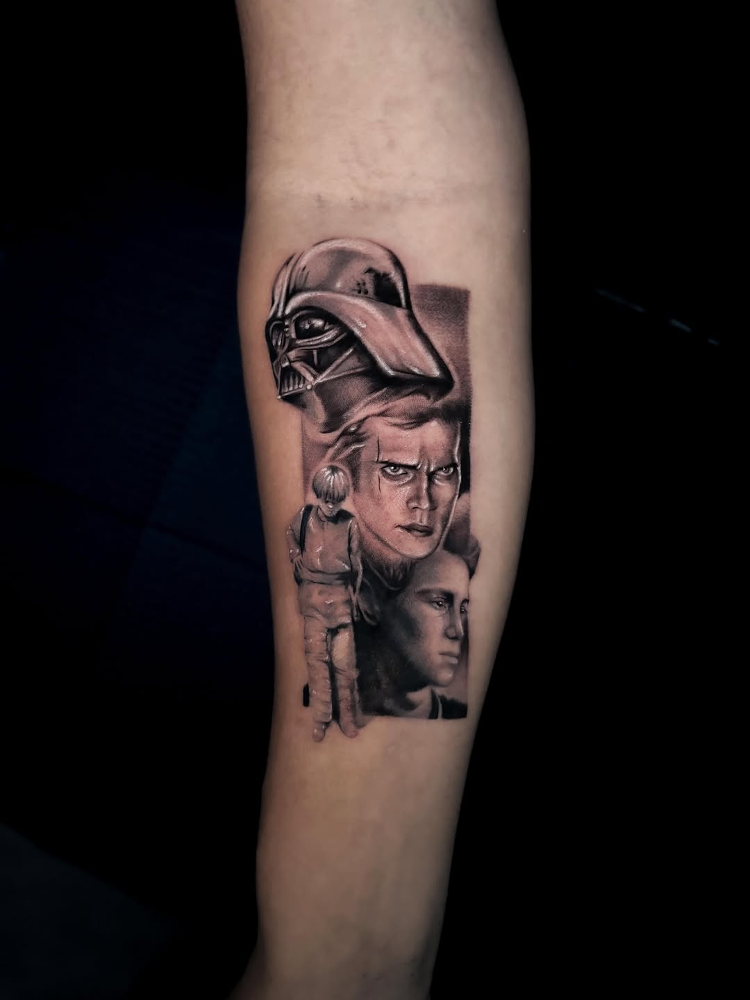 Three stacked portrait faces with Darth Vader helmet above on upper arm, rendered in black and grey with soft shading.