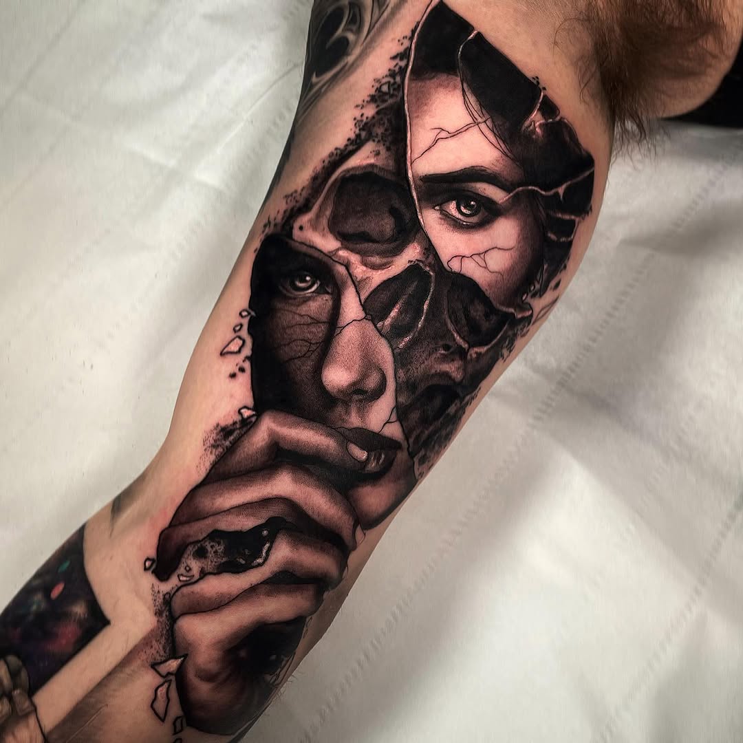 Surreal portrait tattoo on forearm featuring fragmented faces with dramatic shading and intricate detail in black and grey.