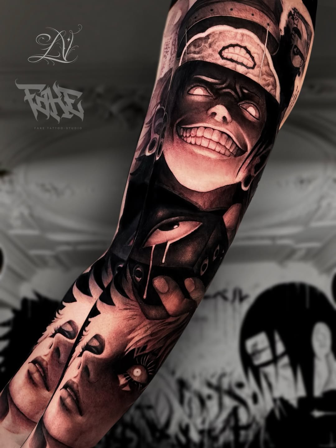 Sleeve tattoo featuring multiple expressive faces with dramatic shading and emotional expressions in black and grey tones on the arm.