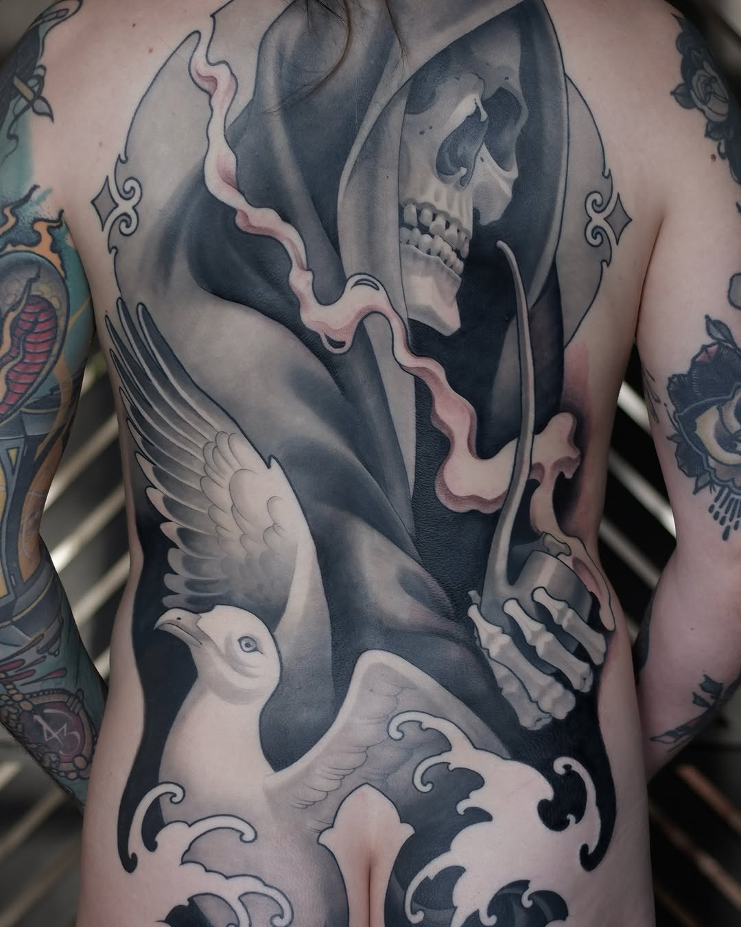 Grim reaper in hooded robes with skull face and scythe, accompanied by white doves on chest and torso, rendered in black and grey with smooth shading.